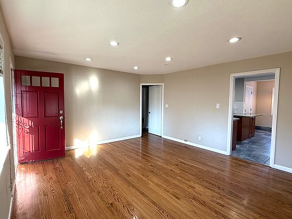 Living room directly adjacent to kitchen