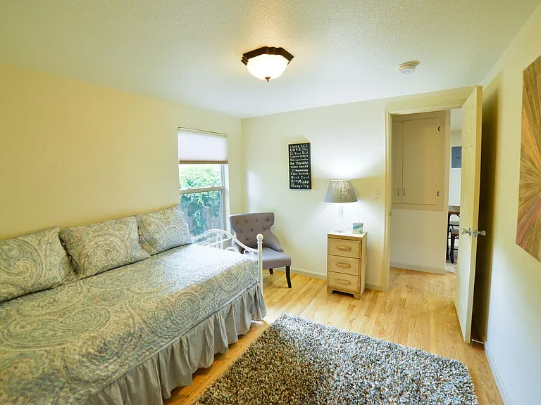 Bedroom 2 with day bed and trundle (bathroom across the hall)