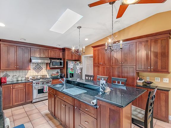 Kitchen with cherry cabinets and granite countertops