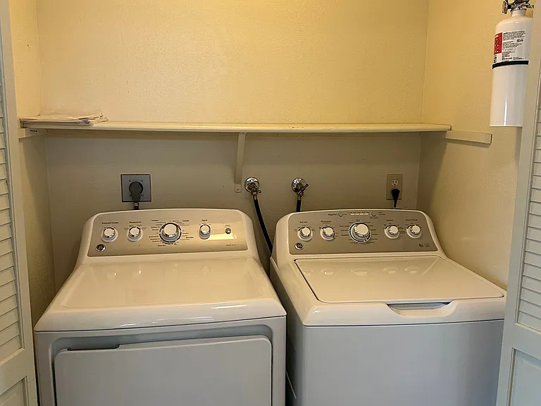 Laundry closet with washer and dryer
