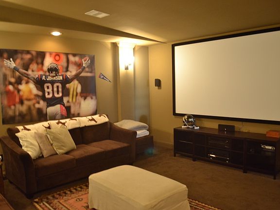 media room with 120" screen and projector system