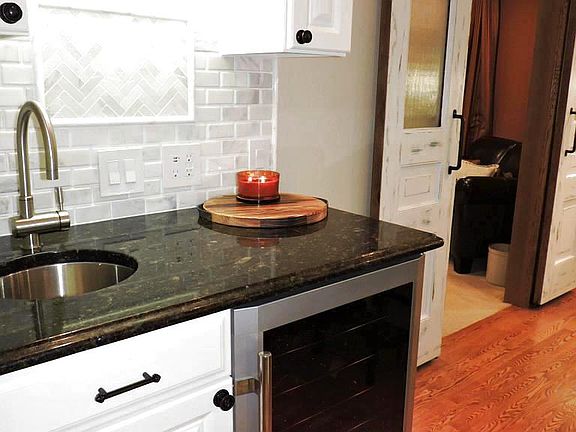 Separate wet bar area in the kitchen for wine and beverages.