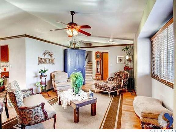 Great Room with Hardwood Floors and Ceiling Fan