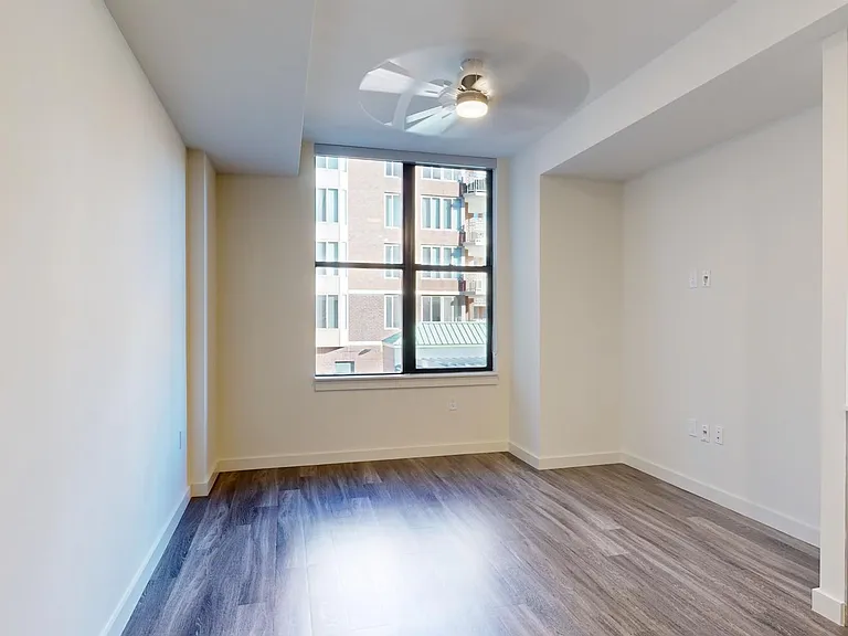 Apartment living room with wood-style flooring.