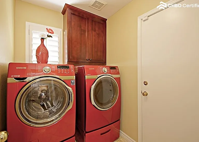 Separate laundry room with high-end washer an