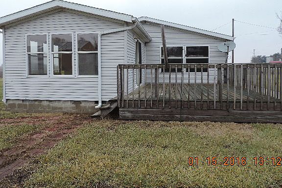 Side with sun room & deck
