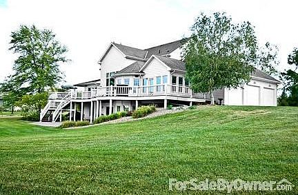 Beautiful traditional style, story-and-a-half home with wrap-around porch.