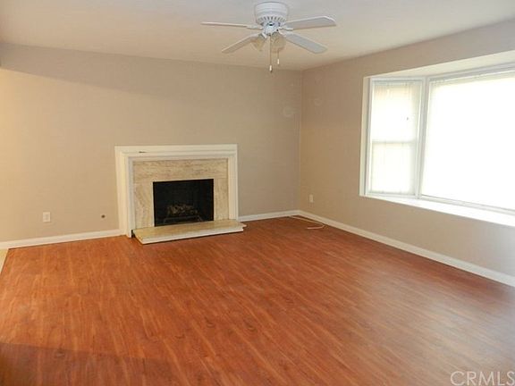 Living Room with Fireplace and All Newer Hard Flooring Throu