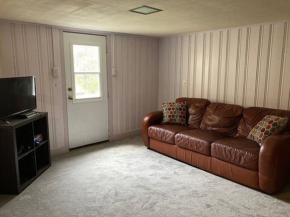 Living room section of the apartment suite. Also looks out to the backyard. Private entrance to apartment.