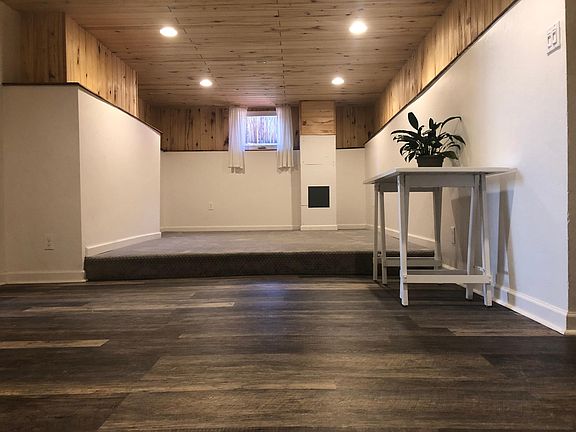 Living area, off of kitchen/entry. Ledge along entire area for plants, books, art, etc.