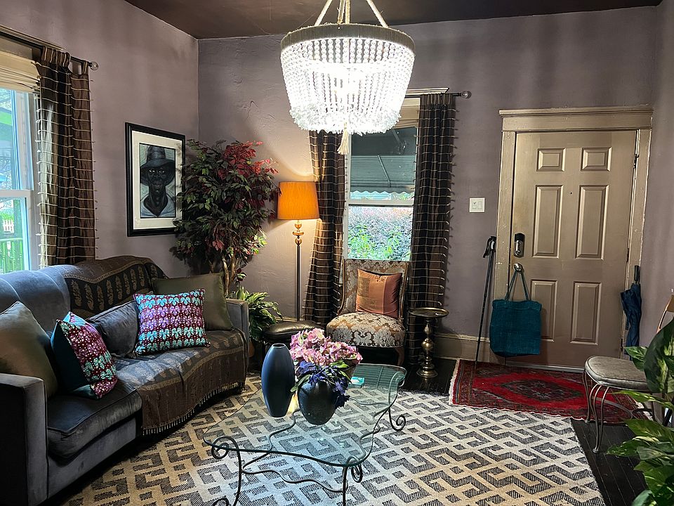 This living room is stylish, colorful and comfortable. Its a great place for conversation or reading a book.
