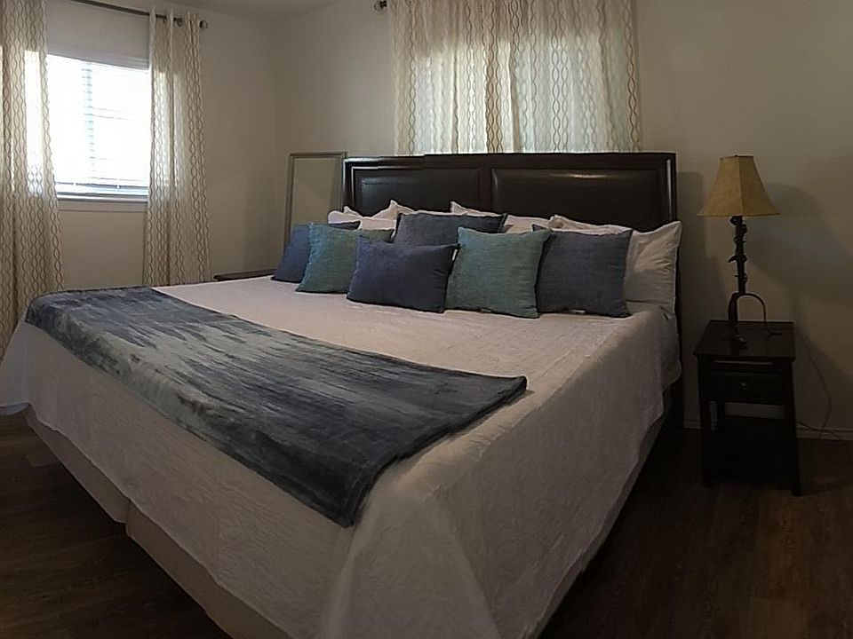 Master queen bed with smart tv