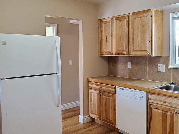 Kitchen with view to hallway - refrigerator included