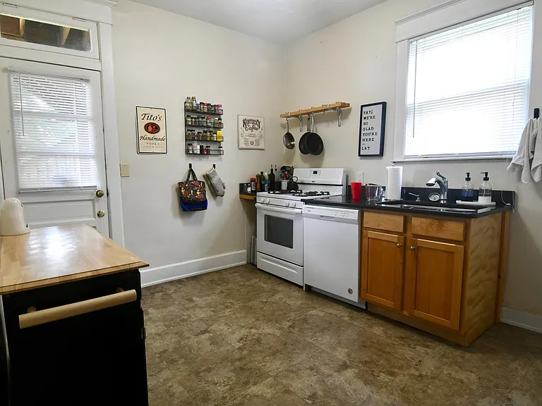 Kitchen with pot hanger and spice rack