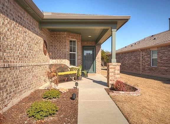 A fun Front Sitting Porch is a perfect spot to park a favorite bench.