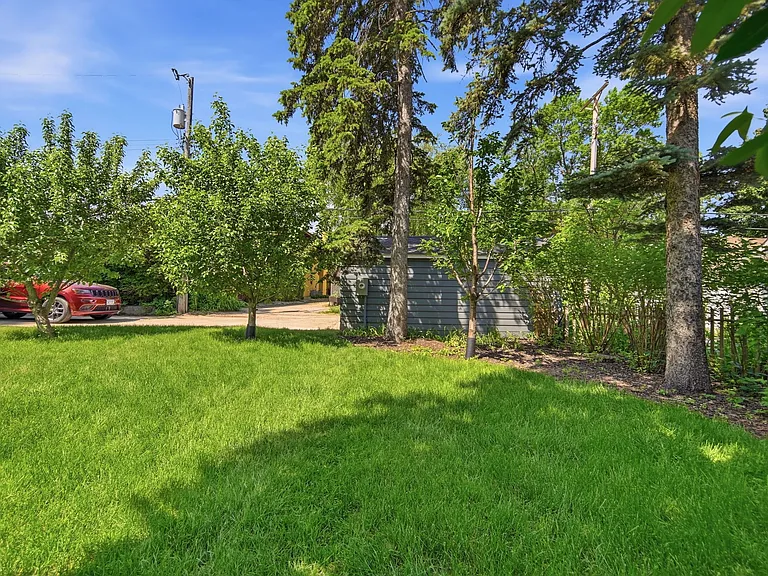 View of upper back yard and private back driveway (connected to Linden Hills Blvd)