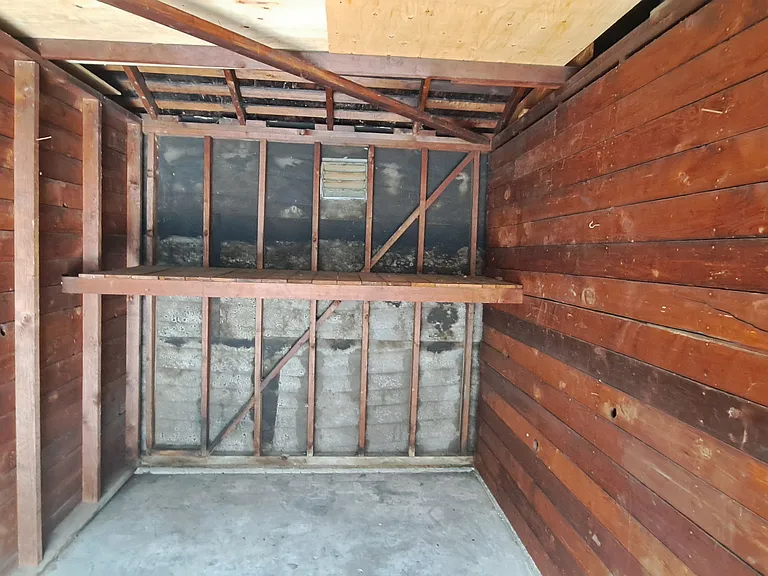 Garage is 17.6 feet x 9 feet private and you have you're own lock. Has shelf for more storage. Garage has no electricity or lights except for outside.