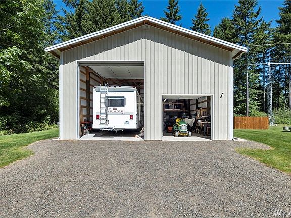 14 foot RV door, loft for storage and a large cedar closet. Insulated, has 50Amp , 220 vac service, metal roof and leaf guard gutters.