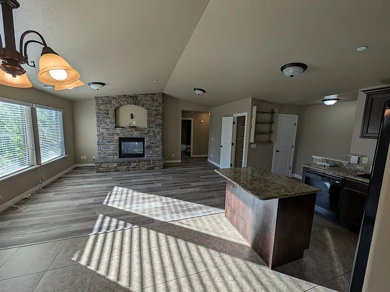 Great room view from dining room towards fireplace