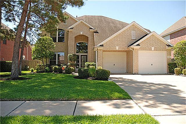 Beautiful custom home with luscious maintained landscape!