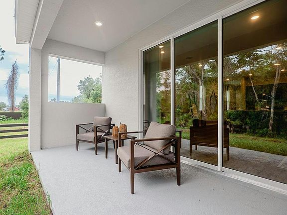 Your interior opens to outdoor living space on a large covered lanai - Birch townhome by Highland Ho