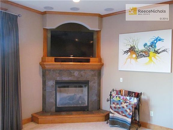NICE CORNER FIREPLACE WITH ROOM FOR TV ABOVE MANTLE