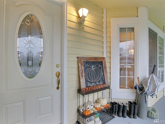Covered porch leads to the inviting entry.