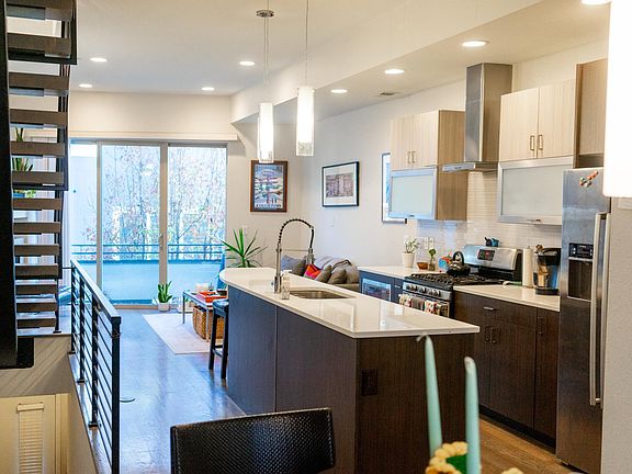 looking across living area floor from dining area