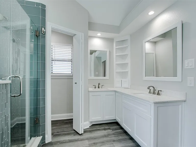 Double sink vanity with storage underneath.