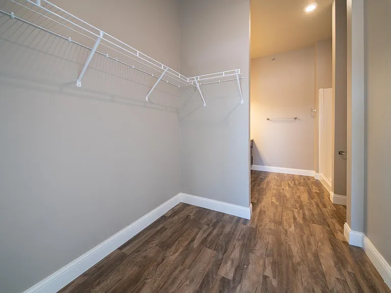 The Rutherford: Master Closet into Bathroom