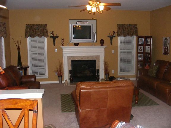 Family room with gas log fireplace, open to kitchen