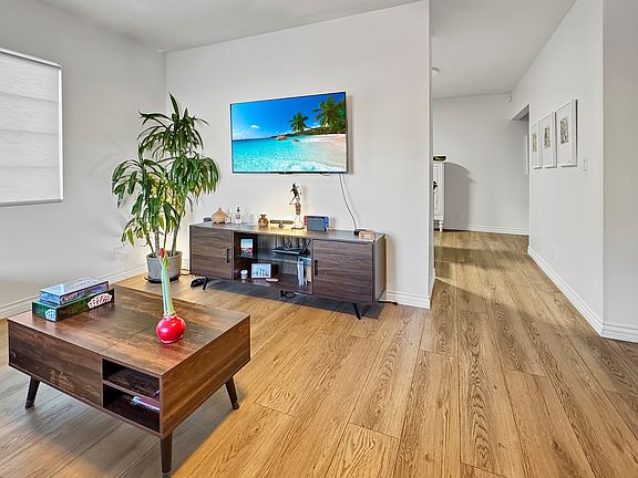 Living room with entryway to kitchen