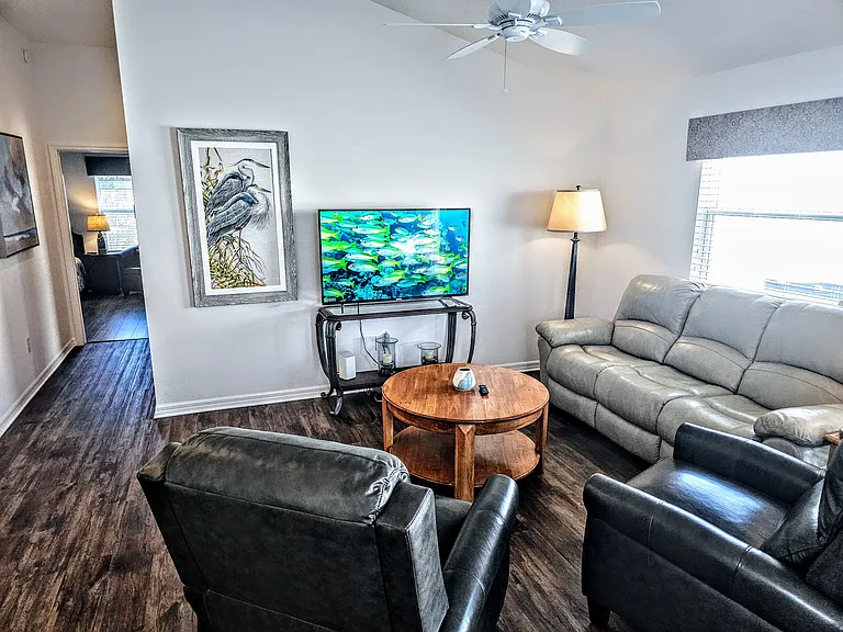 Two rocking recliners along with sofa to watch tv on the 55" smart tv