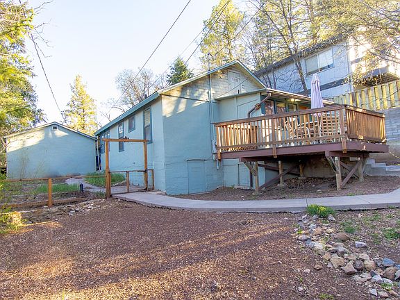 Rear of property viewing the deck rear yard.
The area beyond the small fence is for vegetable gardening.