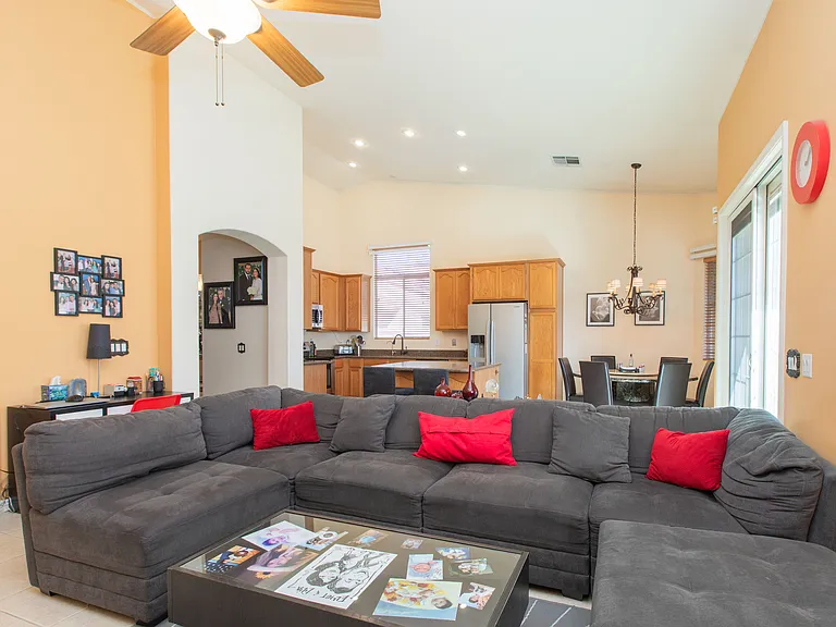 Family room very conveniently adjacent to kitchen featuring vaulted ceilings