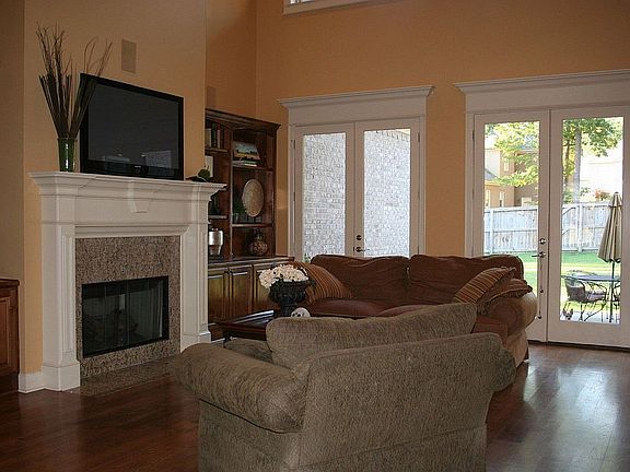 Family room opens onto large level backyard