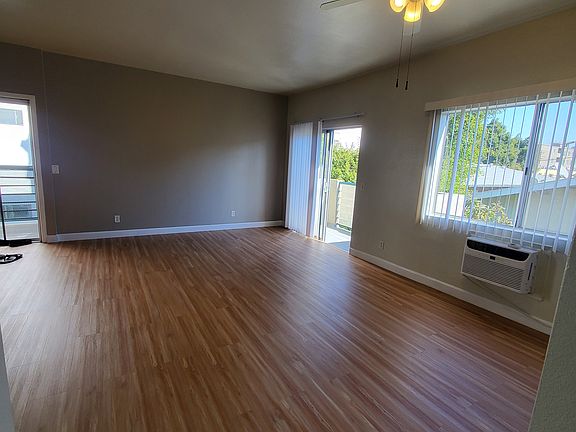 Spacious living area. Slider to the balcony, and window provide natural light and fresh air.