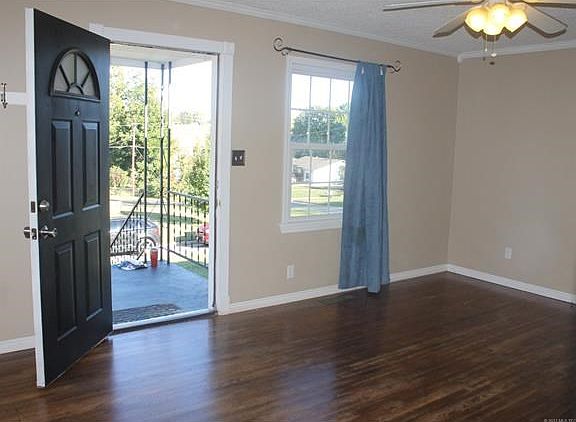 Gorgeous hardwood flooring throughout living room, hallway and bedrooms