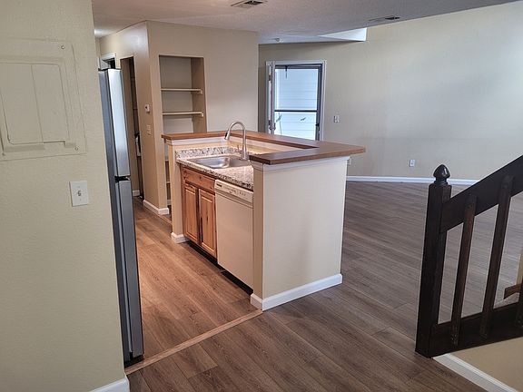 View of Kitchen and Main Entry from Dining Area.