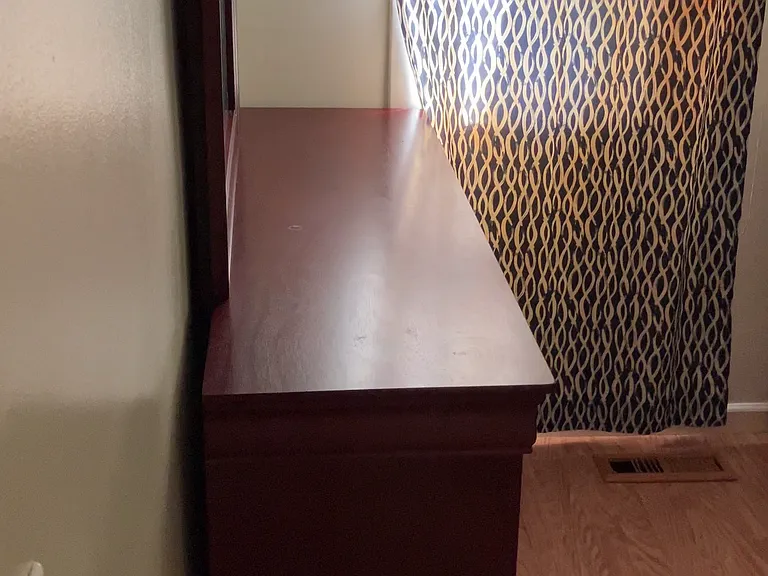 Bedroom 2 includes a dresser