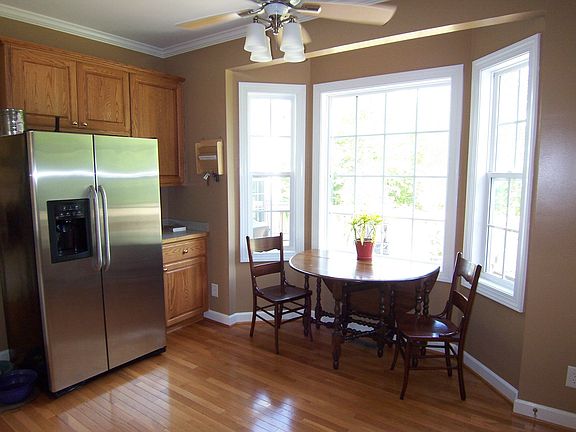 Eat-in kitchen over looks deck and backyard