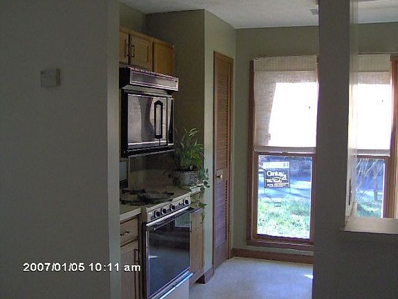 Tall floor to ceiling windows in kitchen and living room!