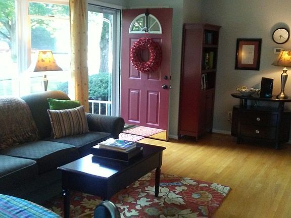 sunny living room w/hardwood floors and picture window