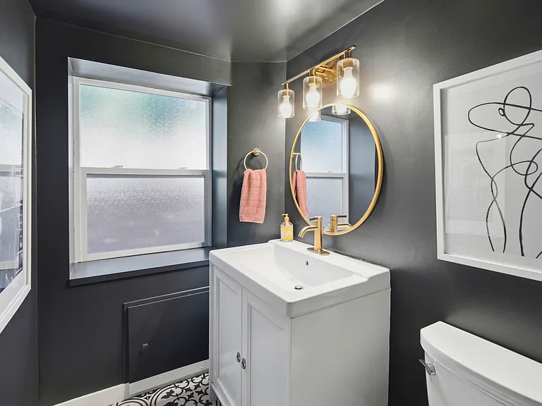 This is the bathroom downstairs. It does have a shower. It's just not photographed here.