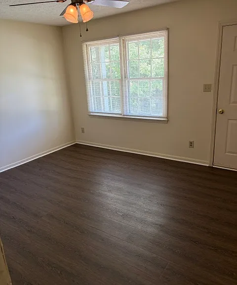 Living room has ceiling fan - lots of natural light