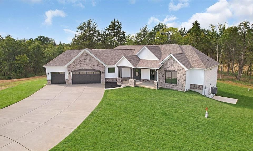 The Cypress Standard Elevation with upgraded garage doors