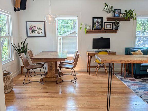 Open concept house; kitchen opens to dining and living room.