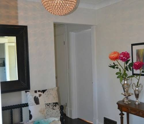 The entrance is the center of the home dividing the bedroom wing from the actual everyday living spaces.  