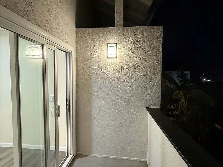 Second smaller private balcony off the living area - at night