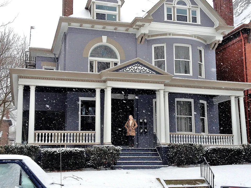Shows the height of the front porch / doors and windows in this house. Front porch swing and new sun room were added last year after this photo was taken.
